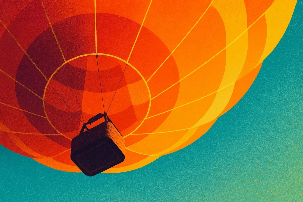 A photo of a colorful hot air balloon against a bright blue sky.